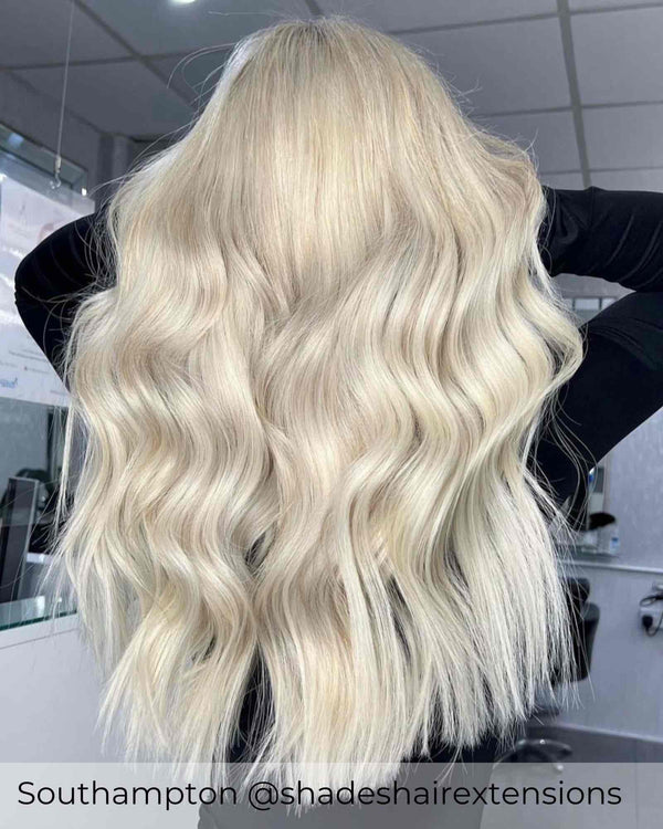 Ash blonde hair achieved with bright ash blonde hair extensions by Viola to add healthy long blonde hair