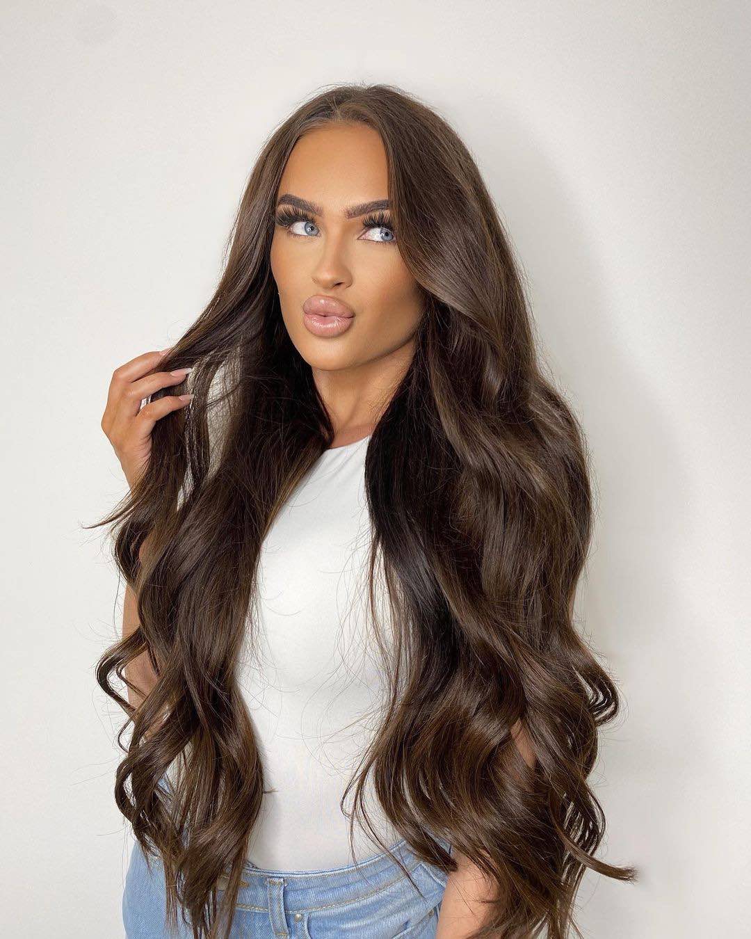 Chocolate brown hair enhanced by adding Viola pure cocoa human hair tape weft extensions to add length and volume