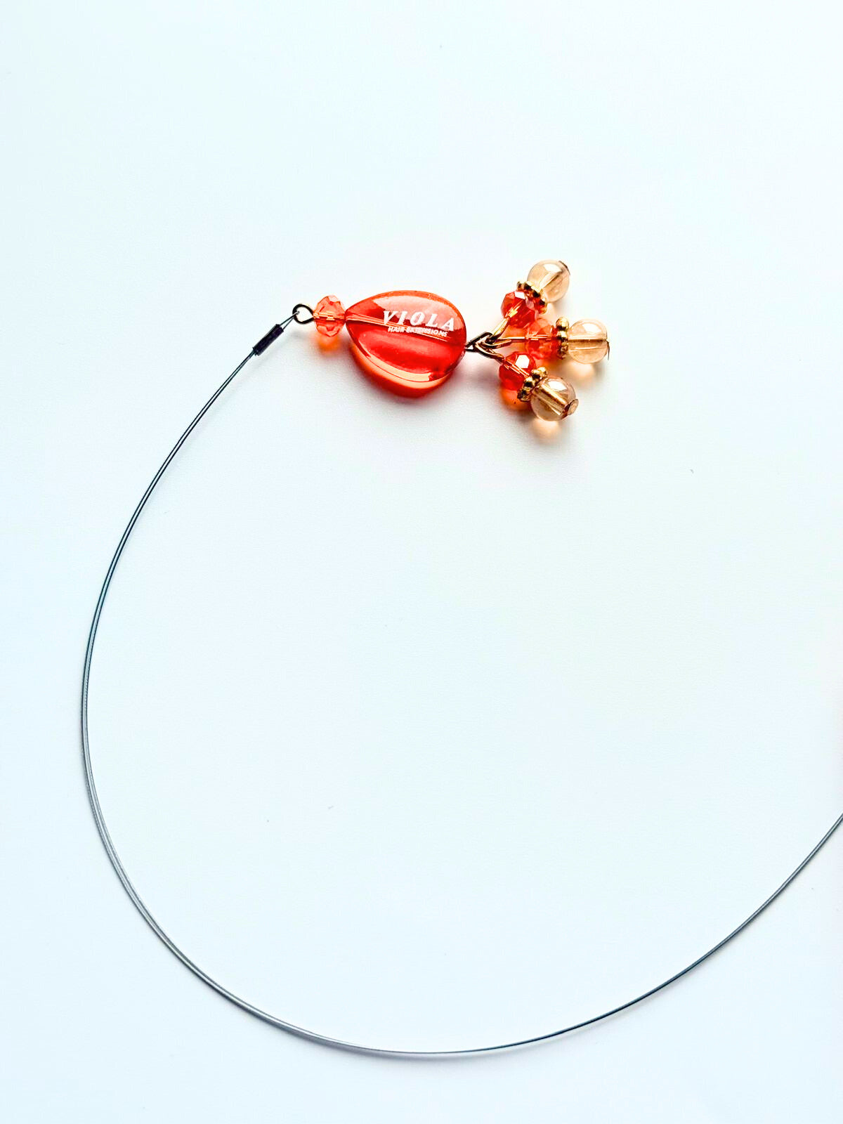 Orange Nano ring application tool by Viola.