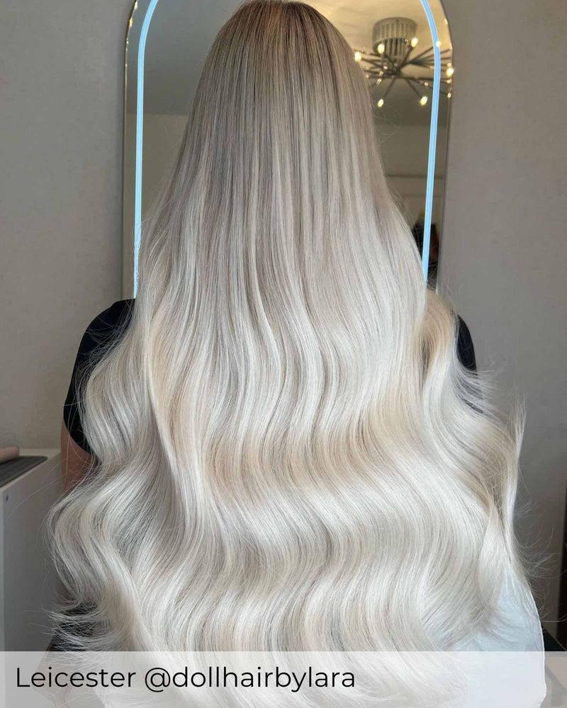 Bright ash blonde hair achieved with platinum ash blonde hair extensions by Viola to add healthy long blonde hair