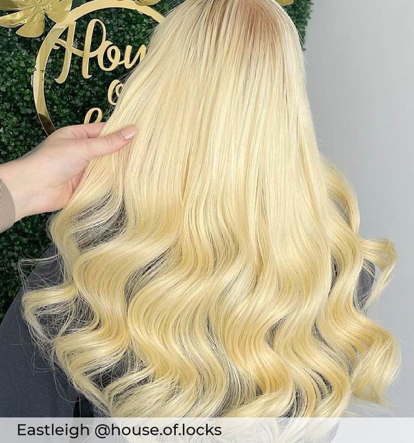 Long bleach blonde hair, curly bright blonde hair with tape in hair extensions adding length volume by Viola hair extensions