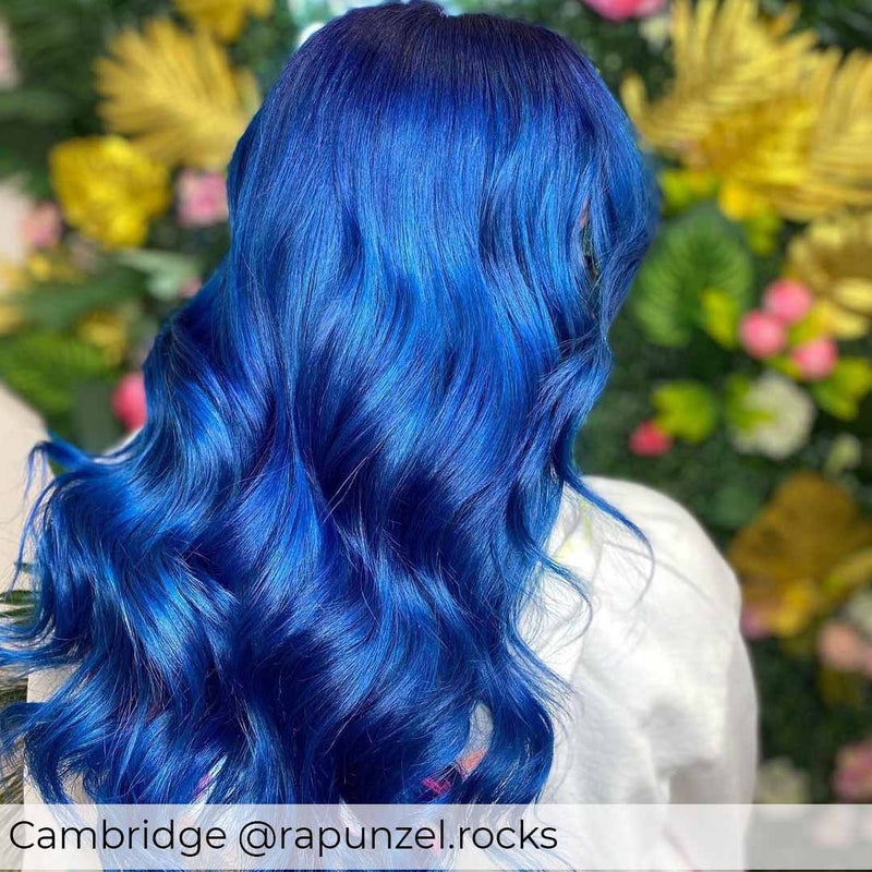 Bright blue hair, achieved with Viola bold, beautiful, blue hair extensions in nano rings adding length and volume to blue hair