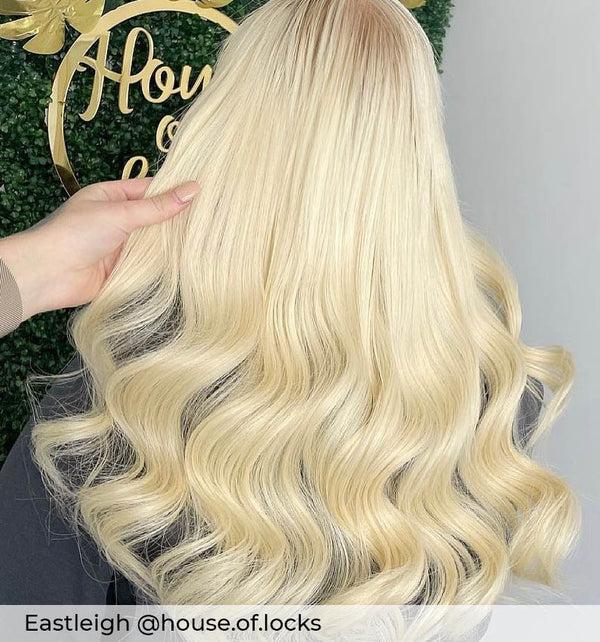 Long platinum blonde hair, curly bright blonde hair with micro ring hair extensions adding length volume by Viola hair extensions