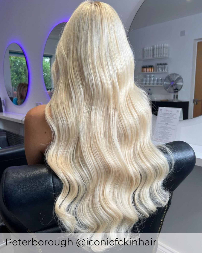 Long platinum blonde hair, curly bright blonde hair with pre-bonded hair extensions adding length volume by Viola hair extensions