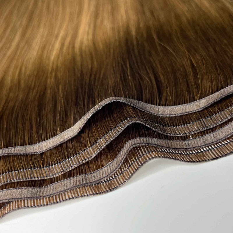 Human tape weft hair extensions UK available in #T4P4/14 balayage medium brown dark blonde mix caramel cappuccino