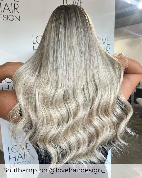 Bright ash blonde hair wearer achieved by having Viola clip in human hair extensions, to create a natural blend long hair