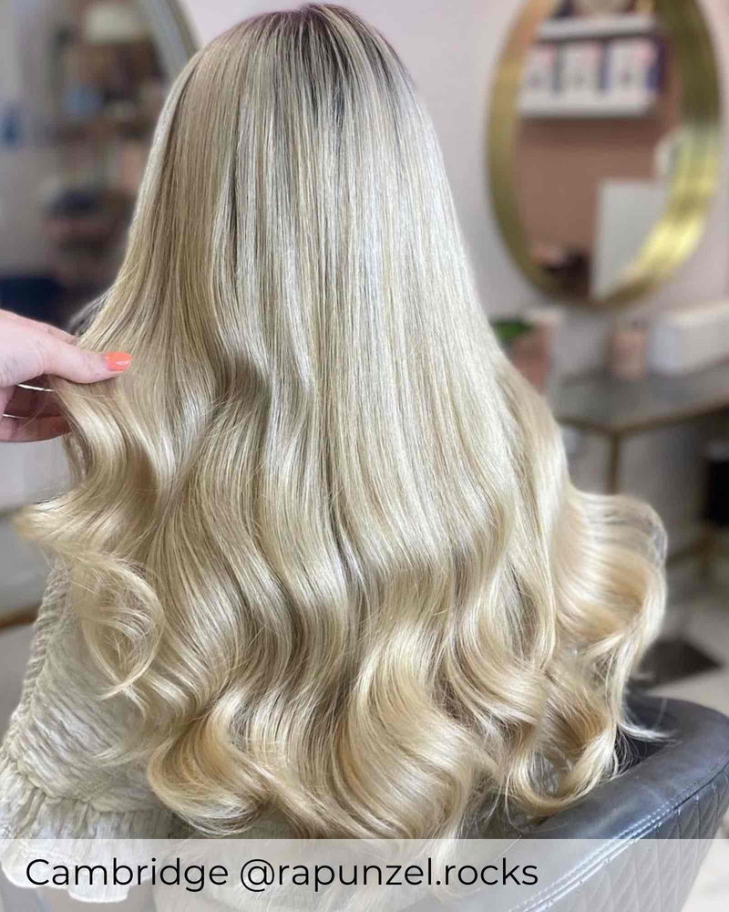 Blonde Balayage hair, wearing Viola micro ring hair extensions in shade Malibu Sunset bright blonde mix hair extensions 