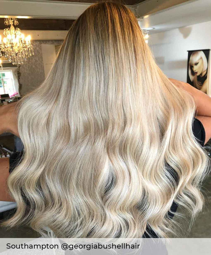 Blonde Balayage hair, wearing Viola Nano ring hair extensions in shade Malibu Sunset bright blonde mix hair extensions 