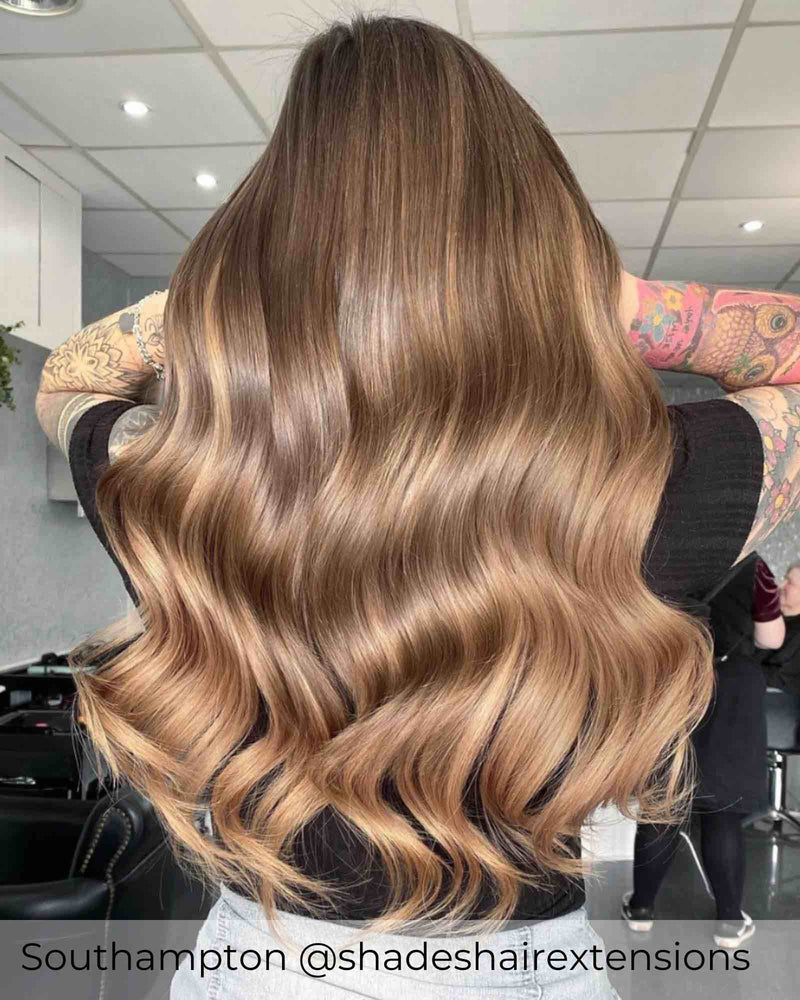 Balayage warm brown hair extensions with a blend of dark brown and honey blonde highlighted human hair extensions by Viola