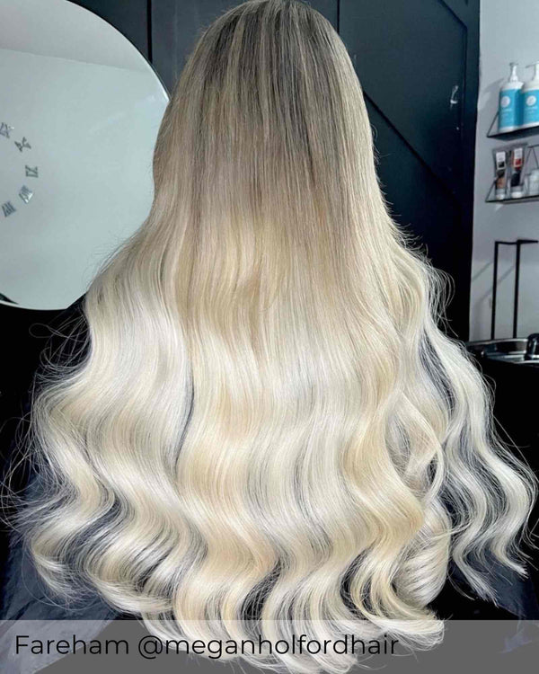 Root Stretch brown to bright ash blonde hair achieved with Viola human hair extensions, brown blending into platinum ash blonde hair