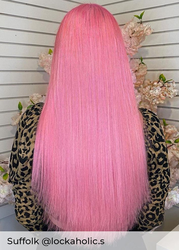 Bright pink hair, achieved with Viola bold, beautiful, pink hair extensions in nano rings adding length and volume to pink hair