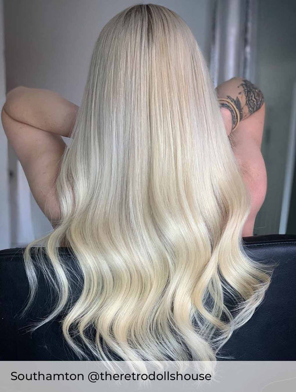 Bright ash blonde hair achieved with platinum ash blonde hair extensions by Viola to add healthy long blonde hair