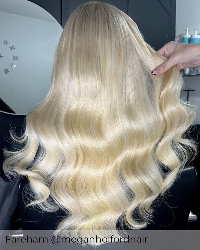 Long platinum blonde hair, curly bright blonde hair with clip in hair extensions adding length volume by Viola hair extensions