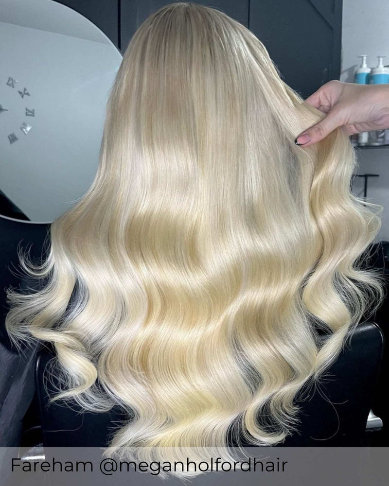 Long platinum blonde hair, curly bright blonde hair with tape in hair extensions adding length volume by Viola hair extensions