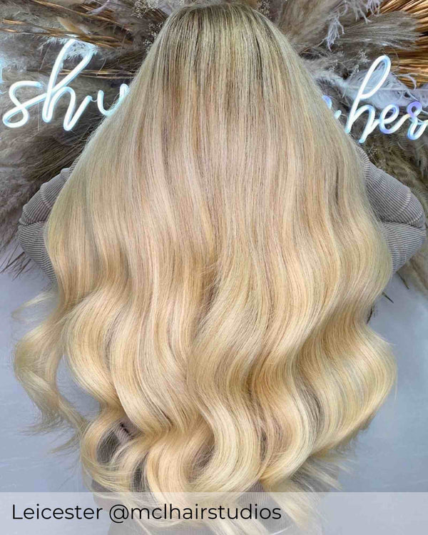 Sandy blonde hair wearer achieved by having Viola weft human hair extensions, to create a natural blend long hair